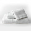 a beautiful set of three white hotel bath towels