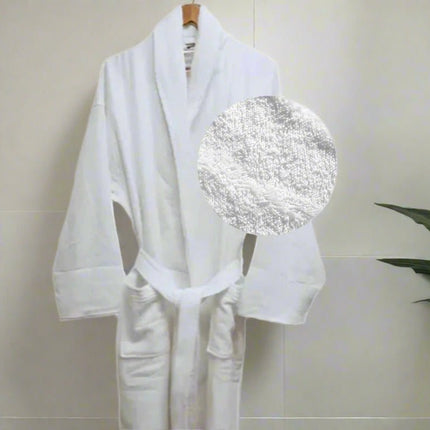 White hotel bathrobe made of 100% cotton, shown with a close-up detail highlighting the soft, textured fabric.