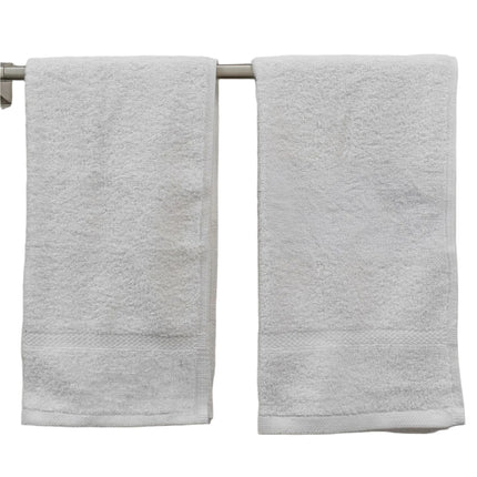 2 pinnacle white hotel hand towels hanging