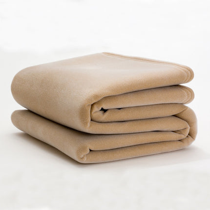 tan colored blanket folded on white background