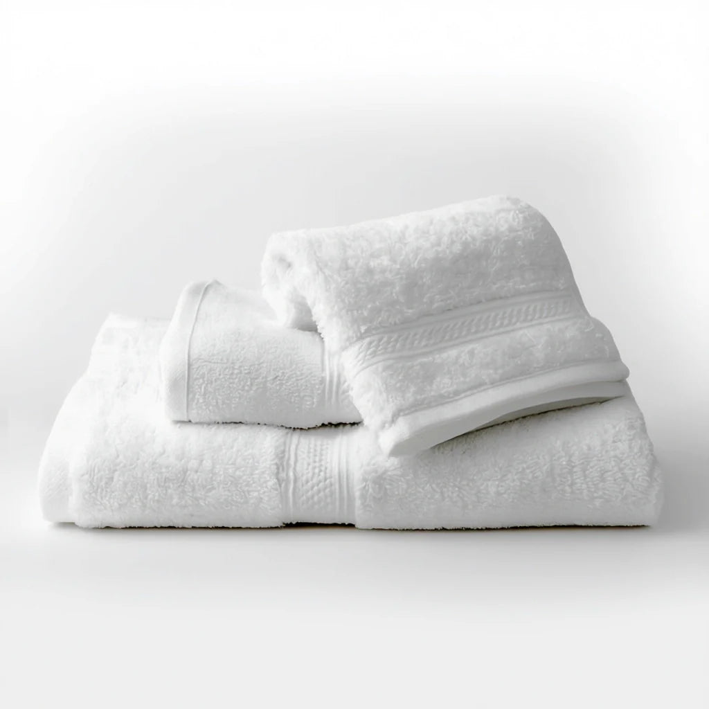a beautiful set of three white hotel bath towels