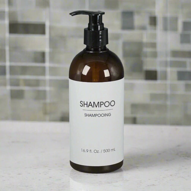 a refillable shampoo dispenser amber bottle in a bathroom