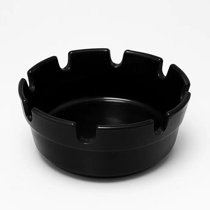Black ashtray on a white background