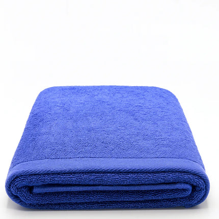 A folded royal blue terry cloth towel on a clean white background.