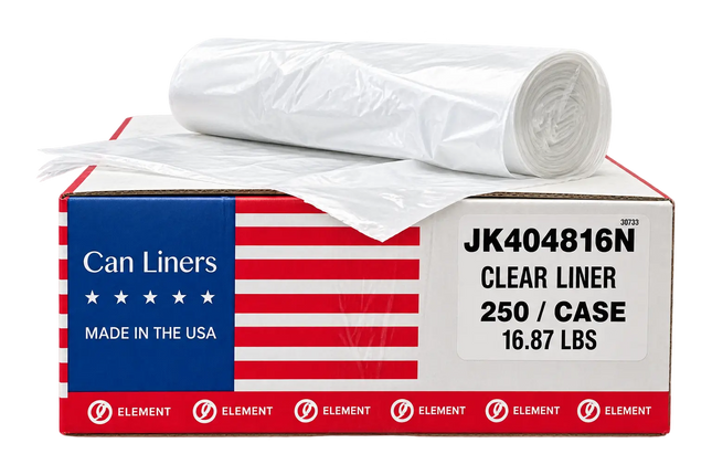 A roll of clear plastic can liners sits on top of a branded product box. The box is white, red, and blue with an American flag design and text reading 'Can Liners,' 'Made in the USA,' and 'Clear Liner 250 / Case 16.