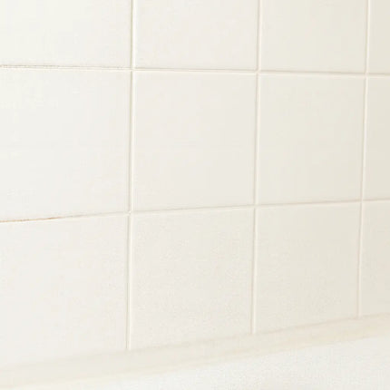 Close-up of white ceramic tiles with a subtle gradient