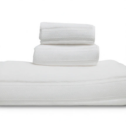 Stack of white towels on a white background