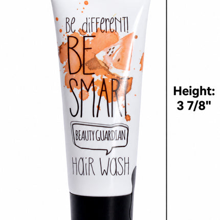 A white tube of Hair Wash with orange paint splatter graphics and black text, including the brand 'Beauty Guardian'. The image features dimension lines and text indicating the product's height (3 7/8"), top width (1 1/2"), and bottom width (7/8").