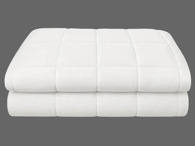 A folded white quilted mattress topper or comforter with a grid pattern, shown on a clean white background.